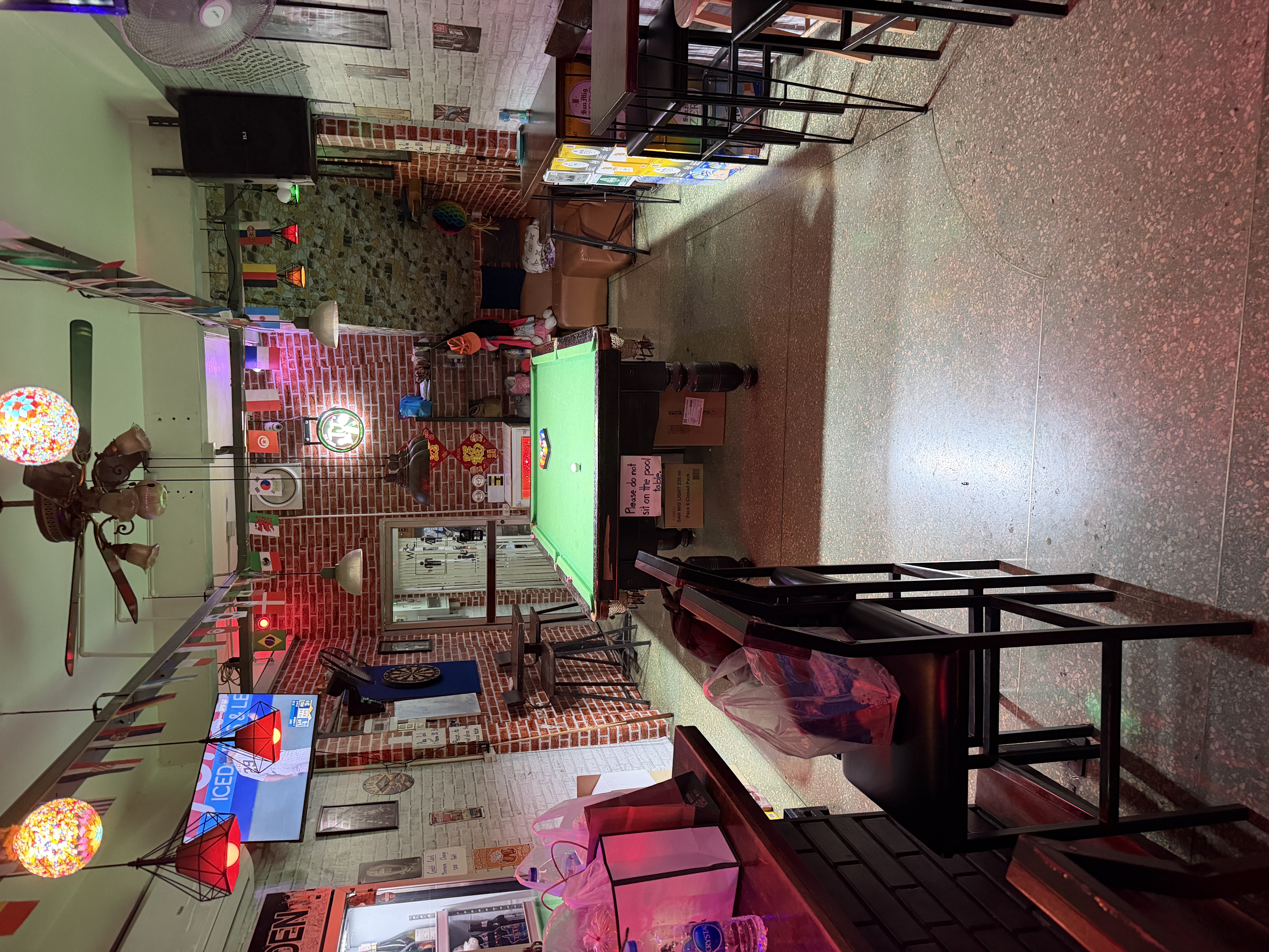 Inside TJ's Sports Bar on Sukhumvit Soi 22 with live sports on screen